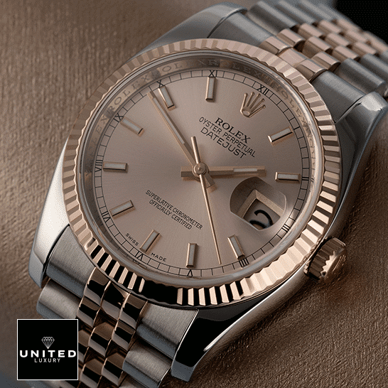 Rolex Datejust 126331-0010 "Sundust" Precision Replica Edition Rolex Datejust Sundust 126331-0010 Rose Gold Fluted Bezel Replica on the table