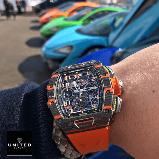 Richard Mille RM 11-03 "McLaren" Top Tier Replica Edition Richard Mille Mclaren hand Richard Mille Mclaren hand Orange Rubber Bracelet cars background