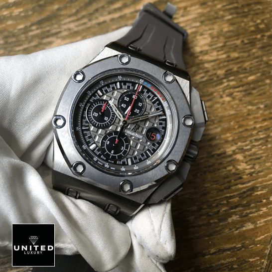 Audemars Piguet Royal Oak Offshore 26568IM.OO.A004CA.01 "Michael Schumacher" Premium Replica 1:1 audemars piguet royal oak offshore michael schumache titanium left Audemars Piguet Royal Oak Grey Dial Steel Bezel Replica on te white glove hand