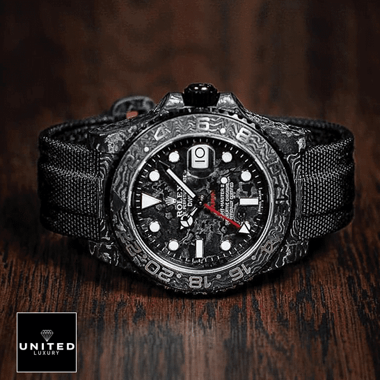 Rolex GMT Master 116610LV "DIW Carbon" Deluxe Replica Edition Rolex DiW NTPT Carbon Black Replica on the table