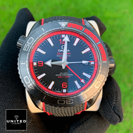 Omega Seamaster Planet Ocean Co-Axial Master Chronometer 215.92.46.22.01.003 "Deep Black" Super Clone Edition omega seamaster planet ocean ceramic 215 92 46 22 01 0 3 black Ddial front two Omega Seamaster 215_92_46_22_01_0_3 Black Dial Replica on the hand grass background