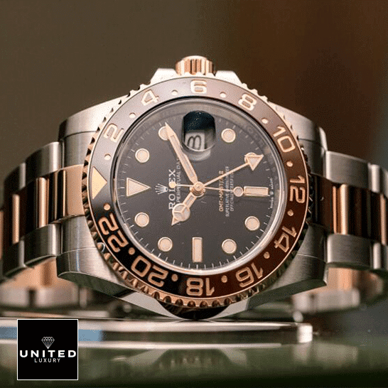 Rolex GMT-Master II 126711CHNR "Root Beer" Deluxe Copy Quality Rolex GMT-Master II Black Dial Ceramic Indices 126711CHNR-0002 Replica on the table